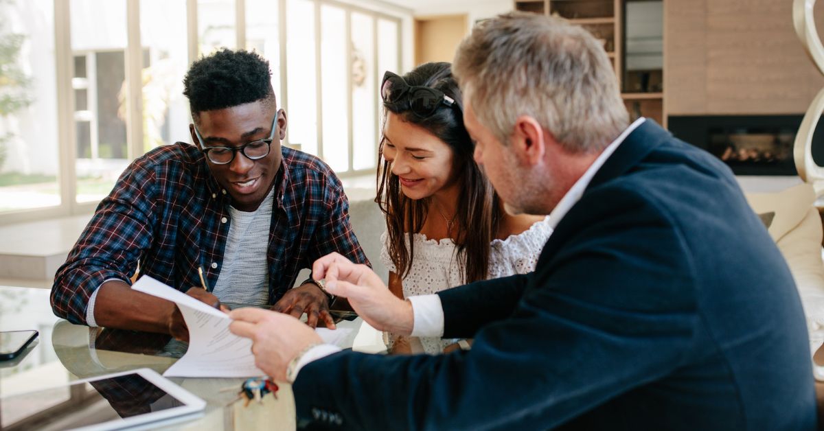 Three people reviewing a document