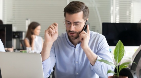 Sales Person Concentrating on the phone