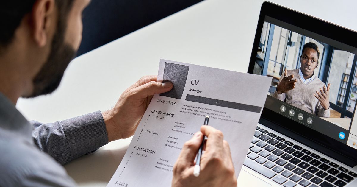 Person reviewing CV in a video job interview