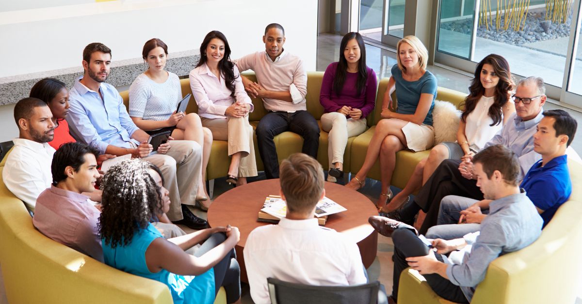 Big team meeting on a sofa