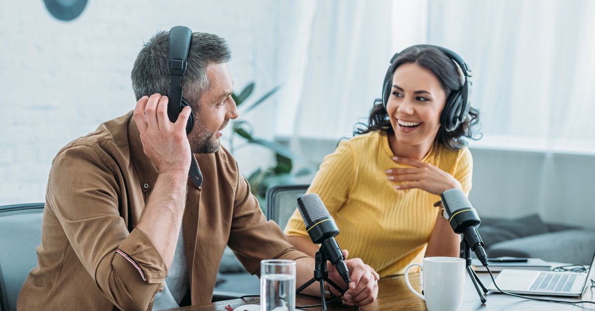 Two people recording a podcast