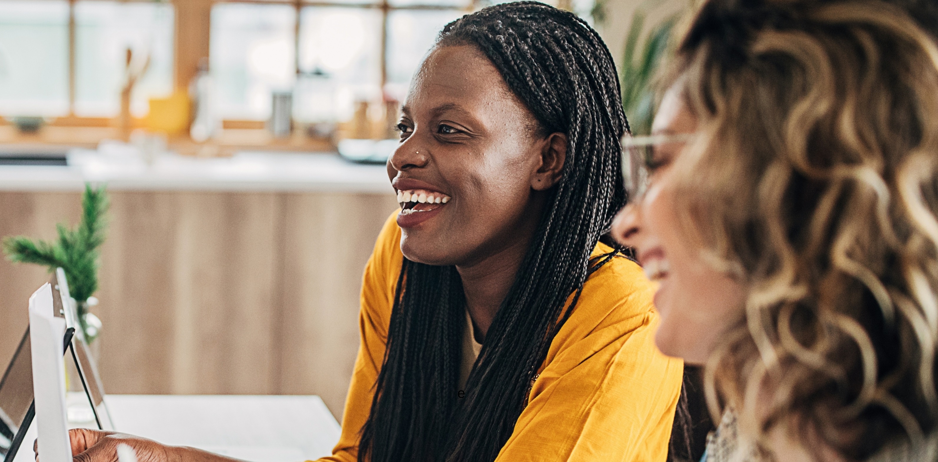 Two people smiling at work