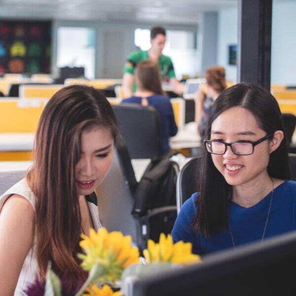 Two people working together in an office