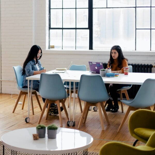 Two people working on a table