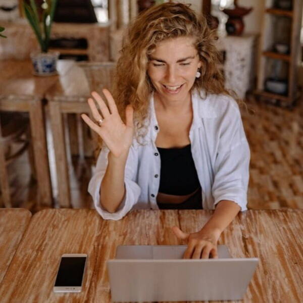 Person waiving on a video call